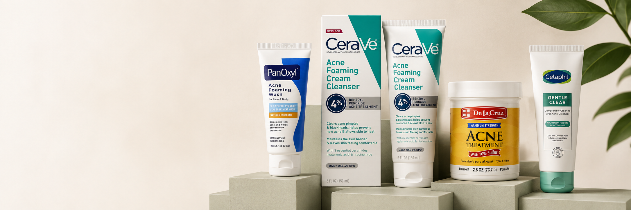 PanOxyl, CeraVe, De La Cruz and Cetaphil skincare on pale studio plinths