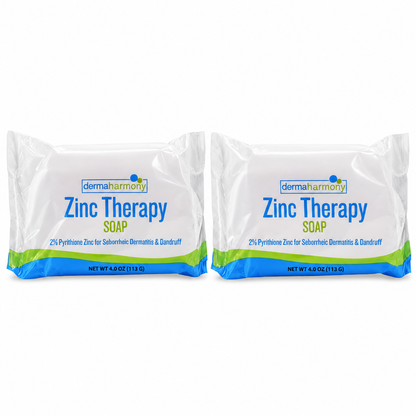 Two wrapped DermaHarmony Zinc Therapy soap bars on a plain white background