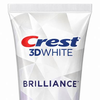 Close-up of the Crest 3D White Brilliance toothpaste tube label on a white background
