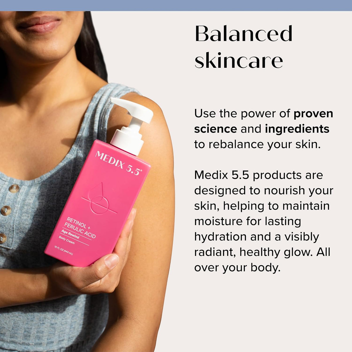 Medix 5.5 Retinol + Ferulic Acid Body Cream - Person holding pink bottle against shoulder