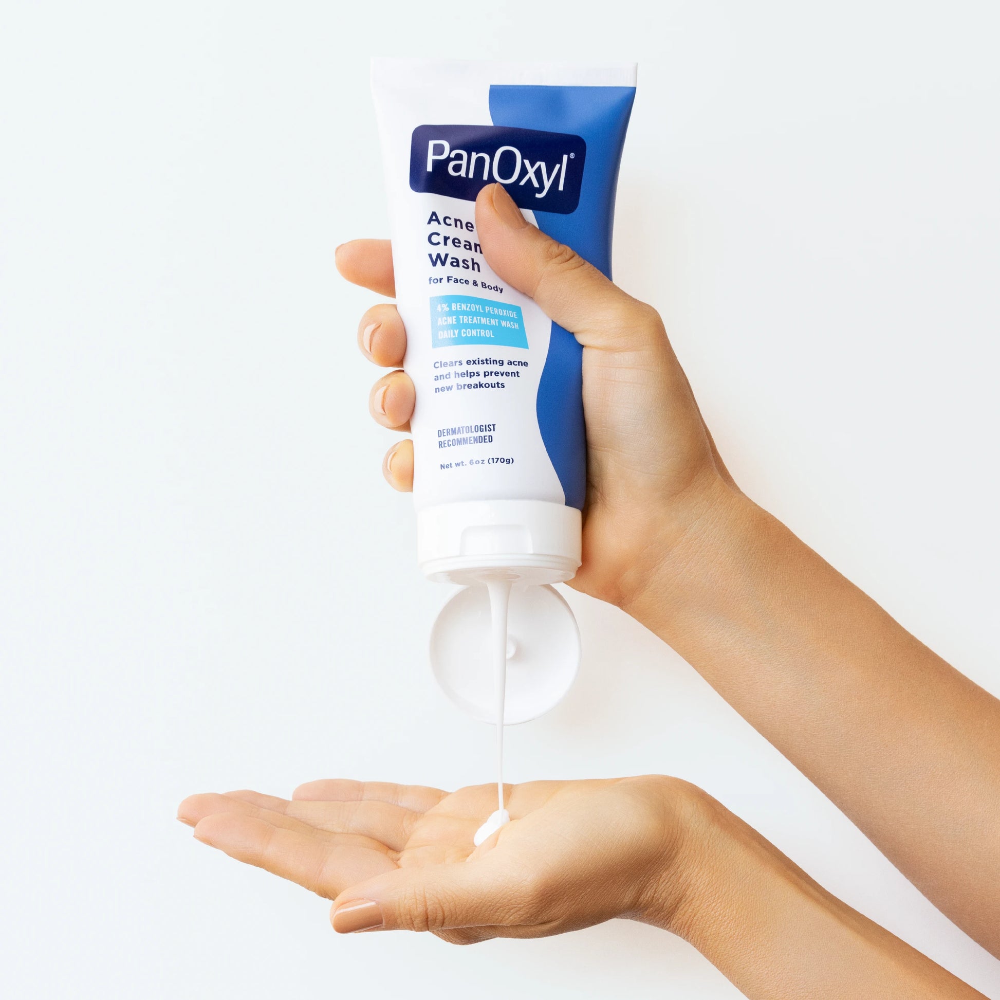 PanOxyl 4% Benzoyl Peroxide Acne Creamy Wash 6 oz being dispensed into a hand