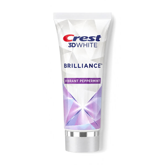 Crest 3D White Brilliance Vibrant Peppermint toothpaste tube standing on its cap on a white background